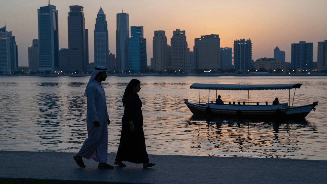 Two people walking peacefully along Dubai Creek at sunset, city skyline reflecting on water.